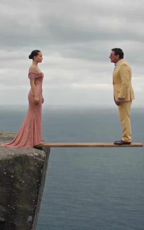 Cover of @peggytan187's TikTok video: How to recreate the viral "One Step to the End" trend The cliffside swing trend with a guy and a girl on a board above the sea Al "One Step to the End" video, t